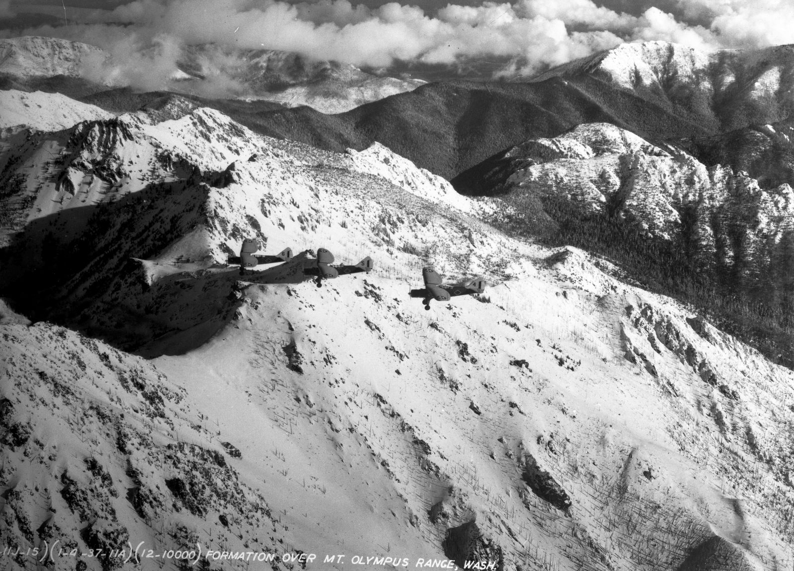 Douglas O-46s of the 91st Observation Squadron over the Mount Olympus range